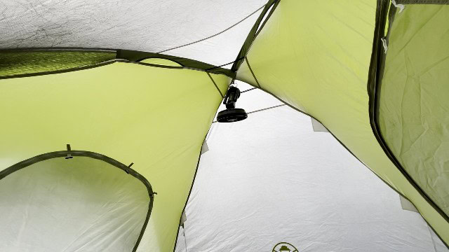 The author using the Coleman OneSource Fan while tent camping.