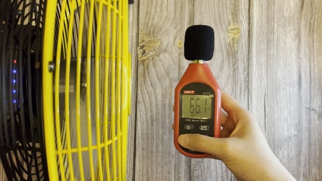 The author measuring the noise level of the Geek Aire Portable Camping Fan.