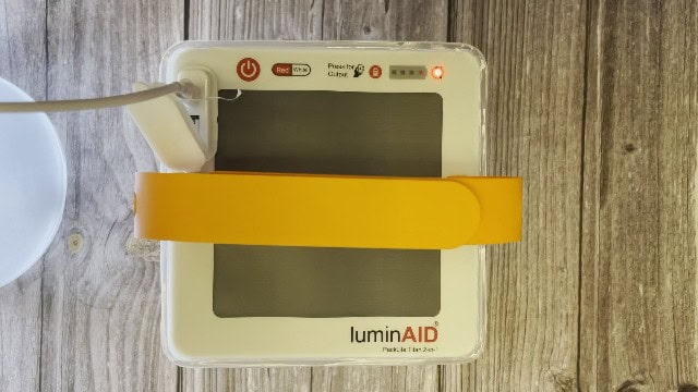 The author charging the LuminAID PackLite Titan via USB.