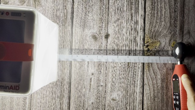 The author measuring the lumen output of the LuminAID PackLite Titan.