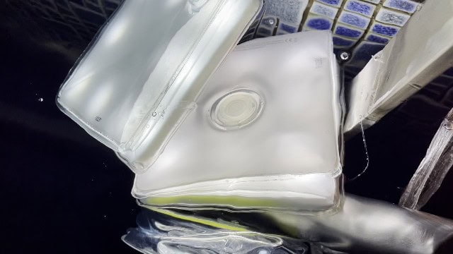 The LuminAID PackLite Titan submerged in water.