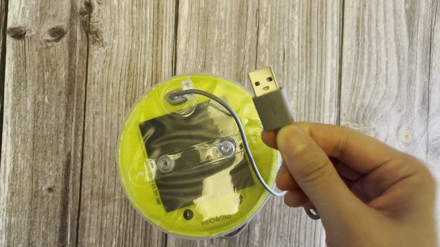 The author charging her MPOWERD Luci Pro Outdoor lantern via USB cable.