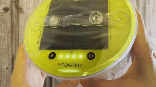 The battery indicator and power button of the MPOWERD Luci Pro Outdoor lantern.