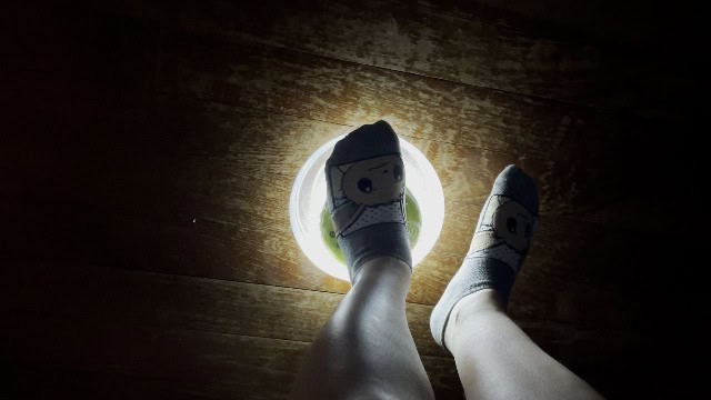 The author standing on the MPOWERD Luci Pro Outdoor lantern.