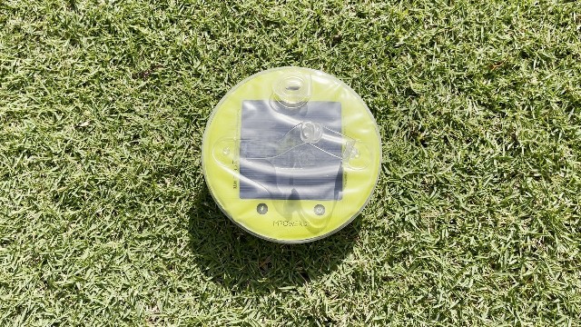 The author charging her MPOWERD Luci Pro Outdoor lantern via solar power.