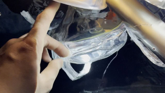 The author submerging the MPOWERD Luci Pro Outdoor lantern for water testing.