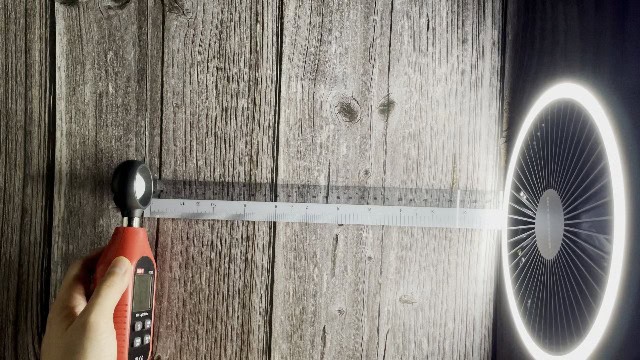 The author measuring the lumen output of the lantern function of the Nitecore NEF10 Fan.