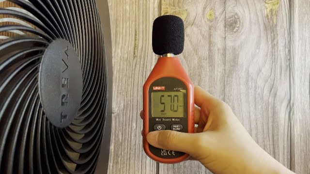 The author measuring the noise level of the O2Cool Treva Fan.