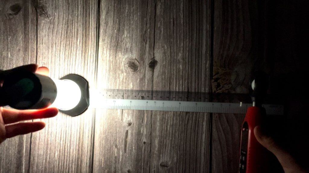 The author measuring the lumen output of the Ledlenser ML6 using a lux meter