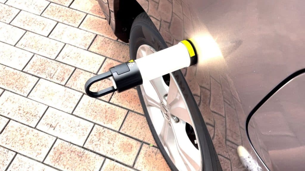 The Ledlenser ML6 magnetically attached to the side of a car