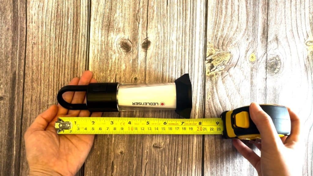 The author measuring the packed size of the Ledlenser ML6